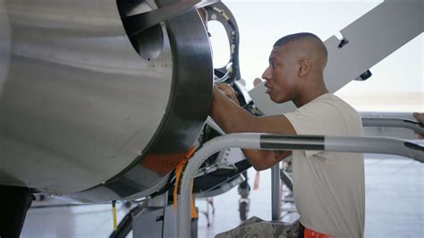 Air Force airplane mechanics working together as a team